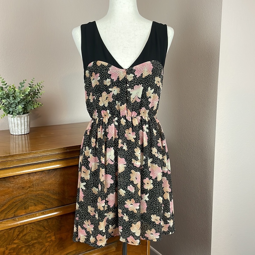 Summer dress featuring a distinctive black bodice &  floral and polka dot skirt